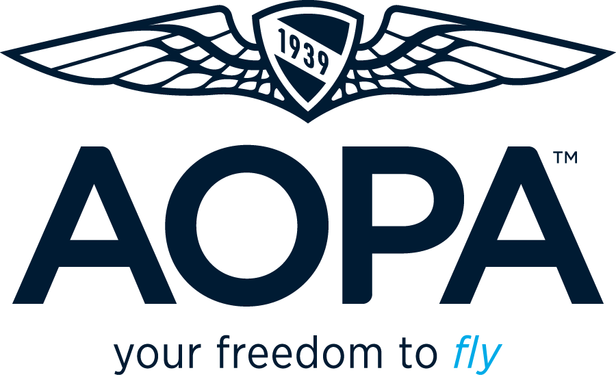 AOPA logo featuring winged emblem with 1939 shield and "your freedom to fly" tagline in navy blue.